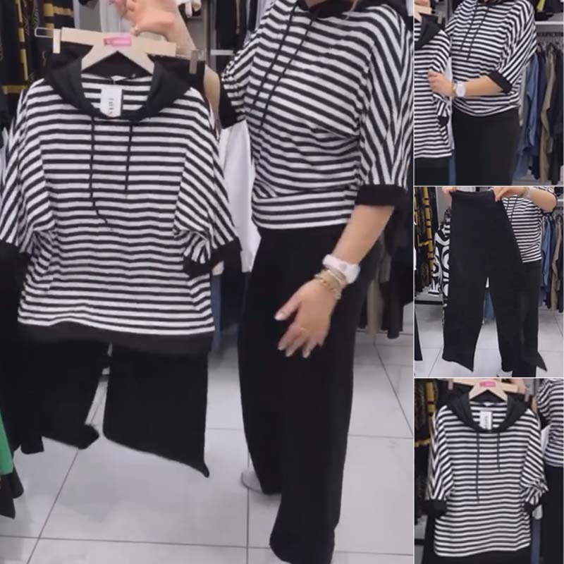 Costum de damă cu top cu dungi și pantaloni de culoare uni